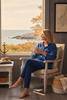 Fall lifestyle image of Color Washed Terry Anywhere Shirt Jacket in New England seaside home